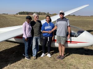 15 year old Lexi H, surrounded by hour folks and CFI Steve R, after her first solo flight.