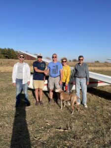 Matt R, along with tow pilot Frank M, CFIG Steve R. Matt's wife Denise, and FSO Tom S, celebrate Matt's first solo glider flight.